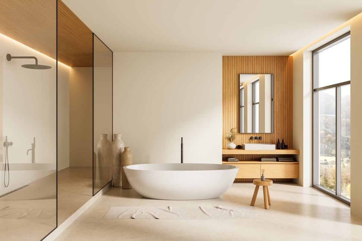 Elegant modern bathroom with white freestanding tub, wood panels, and beige decor, featuring natural lighting from large window. 3D Rendering